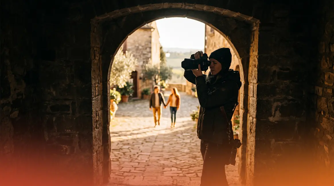 Photography framing tips guide showing photographer composing shot through stone archway with layered depth