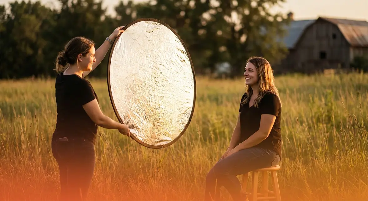 Photographer using a 5-in-1 light reflector outdoors as essential photography gear for beginners